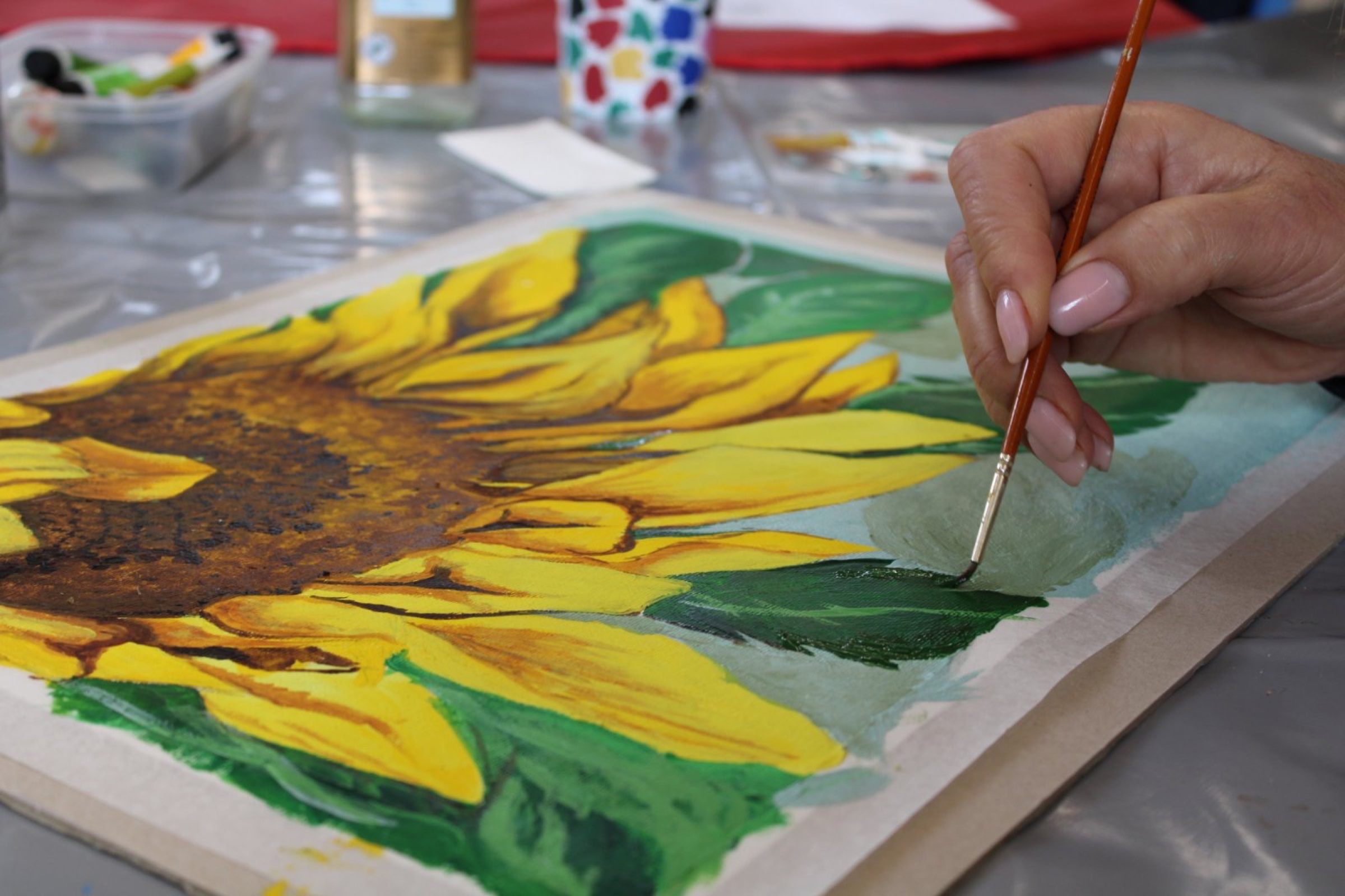 Olena Fomenko painting in her studio